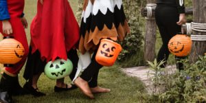 children trick-or-treating on Halloween night