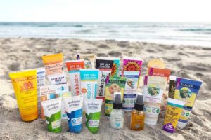 a variety of organic sunscreens on the beach