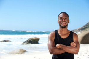 man on beach in muscle tee