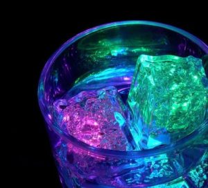 Fun Glow-in-the-dark ice cubes in a cup for backyard party with family