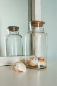 Jar with seashells in it