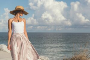 girl on beach in a breezy beach fashion dress