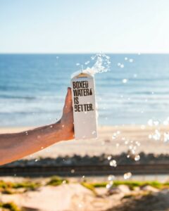 boxed water on the beach