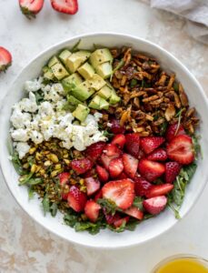 salad with strawberries and avocado and nuts 